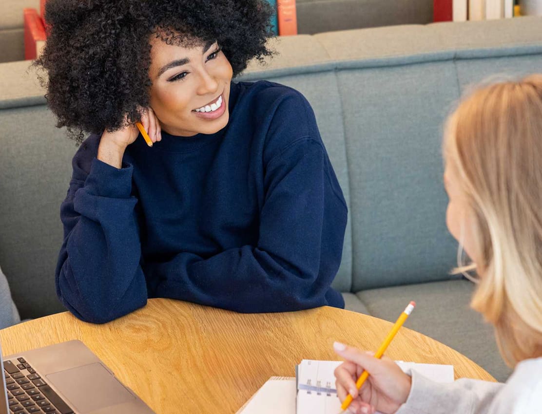 two young women studying