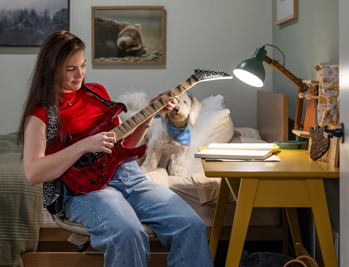 young woman playing guitar
